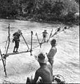 013755 Crossing Stream on way to Buna