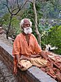 1 Sannyasi in yoga meditation on the Ganges, Rishikesh
