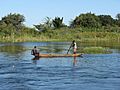 2 locals in a canoe in the Zambezi river