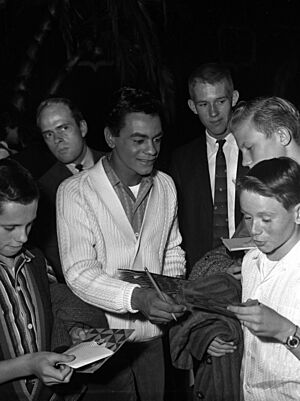 Johnny Mathis signing autographs