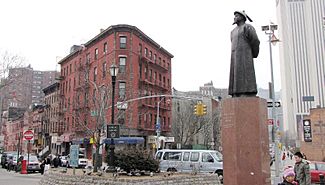 Kimlau Square, a park located in Chatham Square; on left is Oliver Street; on right is St. James Place; the statue is Lin Zexu