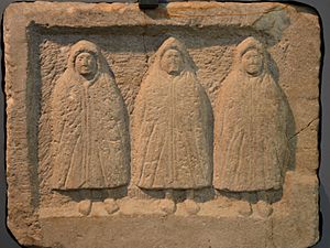 Relief of the Genii Cucullati (hooded deities) found in a shrine in the vicus, early 3rd century AD, Housesteads Roman Fort (Vercovicium) (44588550041)