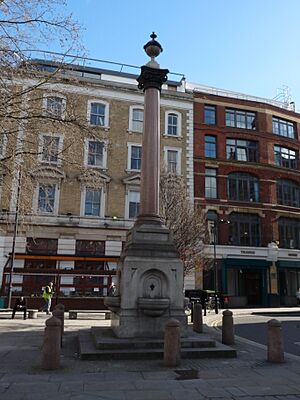 Drinking fountain at junction of Paul Street and Tabernacle Street, Hackney - viewed from west