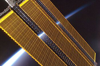 Earth horizon and International Space Station solar panel array (Expedition 17 crew, August 2008)