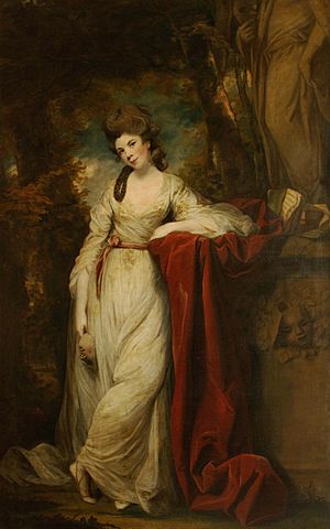 an elegant lady leaning on a velvet drapery on a mantel