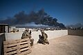 U.S. Army Soldiers, deployed in support of CJTF-OIR, assigned to 2nd BN, 325th AIR, 2nd BCT, 82nd Airborne Division, use a rooftop as an OP in Mosul, Iraq, March 7, 2017