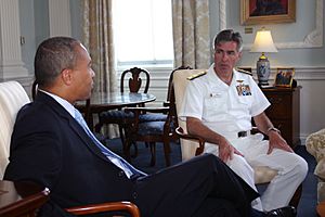 US Navy 080701-N-8110K-015 Massachusetts Governor Deval Patrick speaks with Rear Adm. Kenneth Braithwaite, vice chief of Information at the Massachusetts State House
