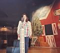 Woman standing on the Ryman Auditorium stage