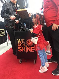 A fan signs the Golden Spike prior to the game on November 11th, 2018