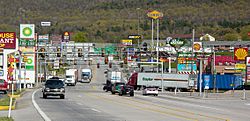 The stretch of U.S. Route 30 in Breezewood, Pennsylvania is one of the few gaps in the Interstate Highway System. A portion of I-70  uses this surface street to connect the untolled interstate highway with the Pennsylvania Turnpike.