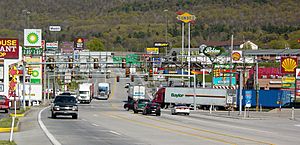The stretch of U.S. Route 30 in Breezewood, Pennsylvania is one of the few gaps in the Interstate Highway System. A portion of I-70  uses this surface street to connect the untolled interstate highway with the Pennsylvania Turnpike.