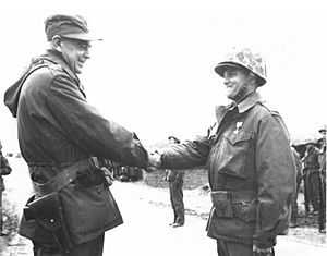 Donald M. Schmuck receiving Silver Star from Francis M. McAlister