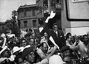 Nasser cheered by supporters in 1956