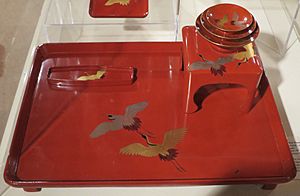 New Year sake set with images of cranes from Japan, lacquer on wood, late 19th century