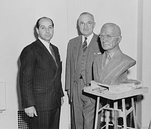 President Truman poses with artist Felix de Weldon and the bust the President has posed for. - NARA - 200019.jpg