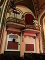 Seats and lighting off stage right at Somerville Theatre
