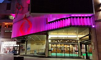 St David's Hall by night, in 2014, showing the remodelled façade and the base of Cardiff's BBC Big Screen.