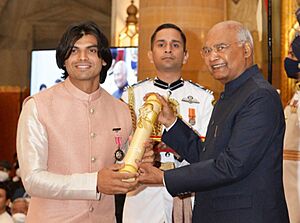 The President, Shri Ram Nath Kovind presenting the Padma Shri Award to Shri Neeraj Chopra, at the Civil Investiture Ceremony-II, at Rashtrapati Bhavan, in New Delhi on March 28, 2022(Cropped)