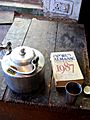 The World Almanac and Book of Facts, 1987, beside a Tea Kettle, Instrument workshop, TIPA, Dharamsala
