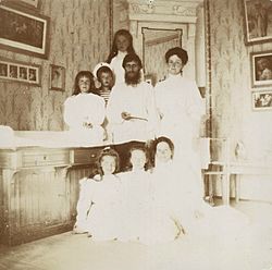 Alexandra Feodorovna with Rasputin, her children and a governess