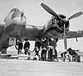 Bristol Beaufighter Mk VIF of No. 96 Squadron RAF being re-armed at Honily, Warwickshire, 23 March 1943. CE22