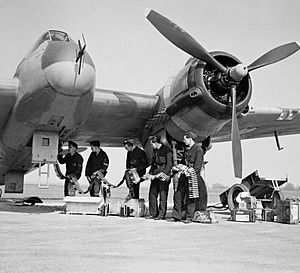 Bristol Beaufighter Mk VIF of No. 96 Squadron RAF being re-armed at Honily, Warwickshire, 23 March 1943. CE22
