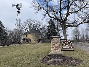 Karen House with Jonathan Association sign