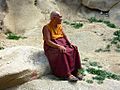 Monk resting outside Thag-Thok Gompa, Ladakh