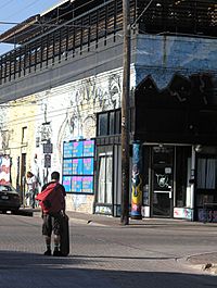 A man with a skateboard in Deep Ellum, East Dallas, Texas