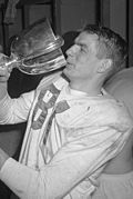 Don Getty drinking from Grey Cup