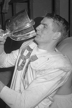 Don Getty drinking from Grey Cup