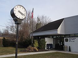 Street clock in front of the Mastic Post Office on Montauk Highway