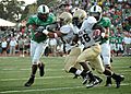 US Navy 071110-N-8053S-140 During the Navy vs. University of North Texas (UNT) football game, Navy Midshipmen running back, Shun White, attempts a to run against UNT's defense.jpg