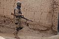 A member of 3rd Kandak, 3rd Brigade, Afghan National Civil Order Police, participates in a dismounted patrol in Sher'Ali Kariz, Maiwand district, Kandahar province, Afghanistan, Feb 120224-A-QD683-059