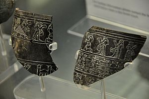 Fragments of a vessel dedicated to the temple of god Nergal. Shalmaneser III kneels before Nergal. From Nineveh, Iraq. The British Museum, London