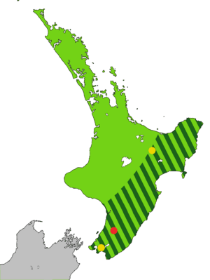 Map of the North Island of New Zealand coloured light green with dark green stripes from the central mountains to the sea along the east coast to Wellington, and one red and two yellow dots.