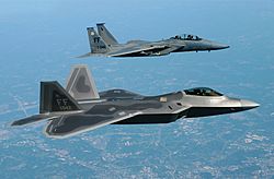 The first operational F-22A Raptor alongside an F-15D Eagle on its delivery flight to Langley AFB in May 2005.