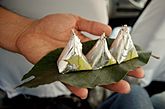 Paan, (betel leaves) being served with silver foil, India