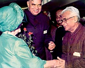 Pandit Ram Kishore Shukla with Dr. Balram Jakhar and Queen Elizabeth The Queen Mother at Buckingham Palace in 1984