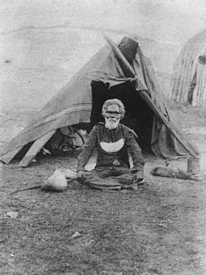 Aboriginal man, Bilin Bilin, sitting outside a tent at the Deebing Creek Aboriginal Mission, ca. 1900