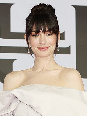 A head shot of Anne Hathaway as she poses for the camera