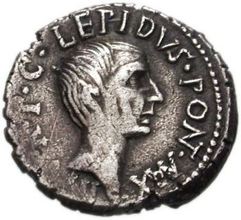 Grey coin depicting male head facing right