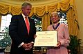 President Bill Clinton presents Rosa Parks with the Presidential Medal of Freedom in the Oval Office