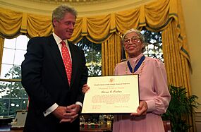 President Bill Clinton presents Rosa Parks with the Presidential Medal of Freedom in the Oval Office