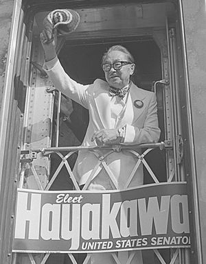 Samuel Ichiye Hayakawa waving from back of train during his U.S. Senate campaign in California, 1976