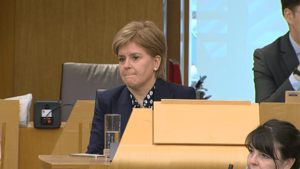 Nicola Sturgeon sits on the backbenches following her resignation