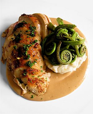 Pan Roasted Chicken Breasts, Garlic Mashed Potatoes, Fiddlehead Ferns and Sauce Supreme