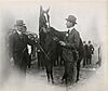 Regret with trainer James Rowe and owner Harry Payne Whitney, 1915.jpg
