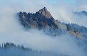 Steeple Rock in clouds