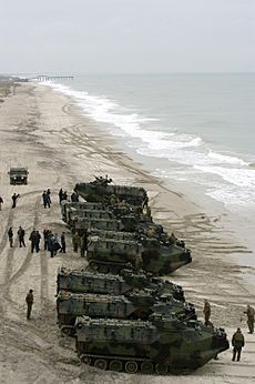 US Navy 060223-N-2636M-093 U.S. Marine Corps Amphibious Assault Vehicles (AAV) assigned to the 2nd AA Battalion, Bravo Company arrive on Onslow Beach as part of a beach invasion exercise